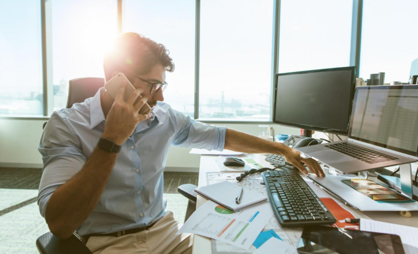 Instructor reviewing workshop materials with participant